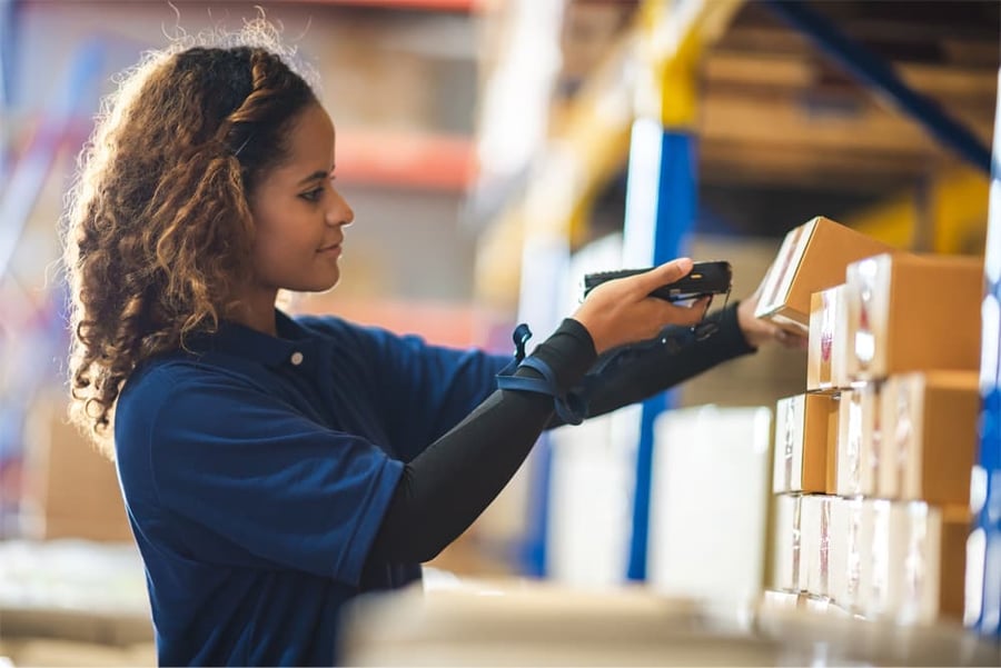 woman scanning box