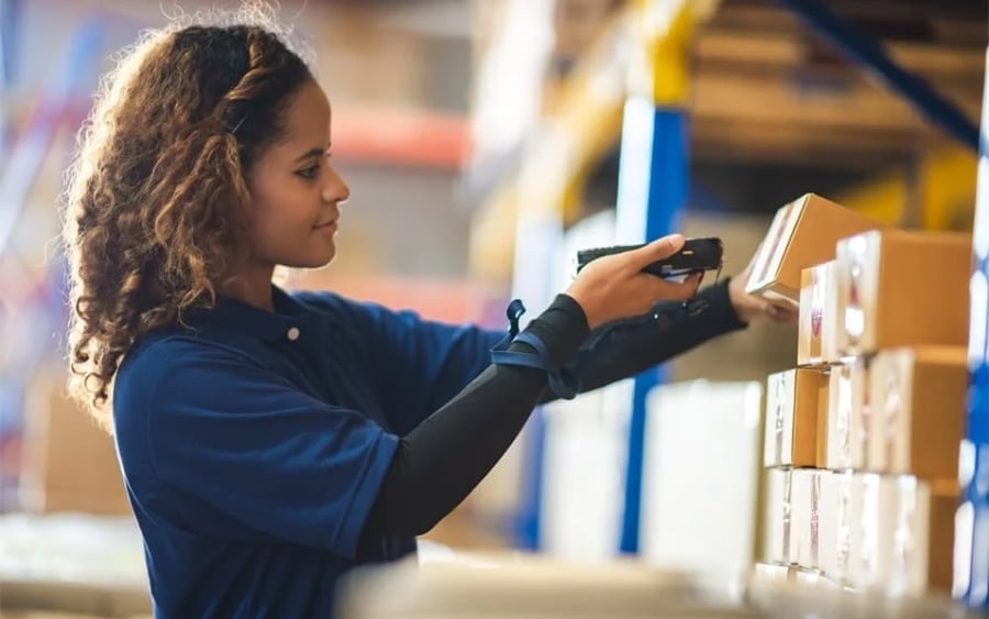 woman scanning box